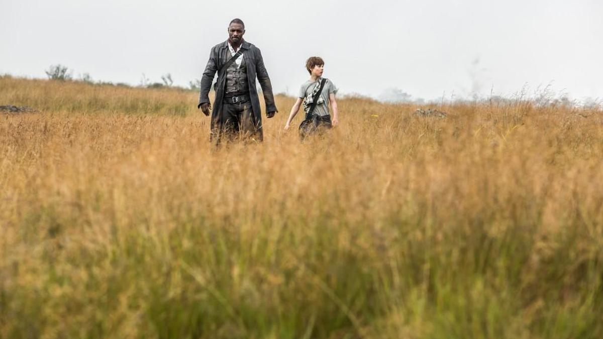 Idris Elba and Tom Taylor in “The Dark Tower,” adapted from Stephen King’s series of novels that follows a kid who lands in another world and teams up with a gunslinger played by Elba.