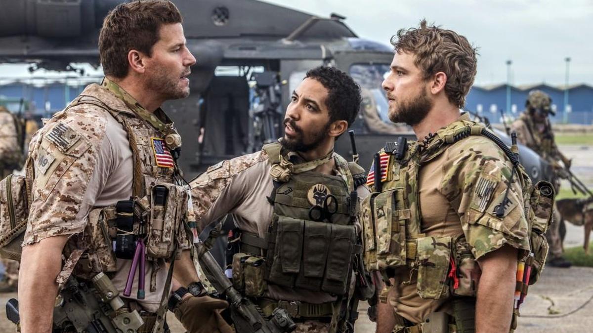 This image released by CBS shows David Boreanaz, from left, Neil Brown Jr. and Max Thieriot in a scene from “SEAL Team,” premiering Sept. 27, on CBS.