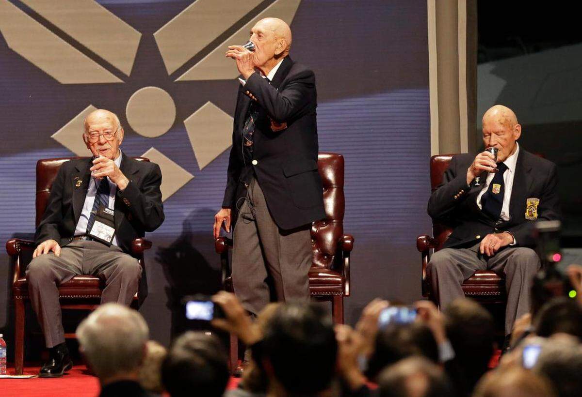 Richard Cole, center, enjoys a toast with two other surviving members of the 1942 Tokyo raid led by Lt. Col. Jimmy Doolittle – Edward Saylor, left, and David Thatcher – in 2013 at the National Museum of the U.S. Air Force in Dayton, Ohio.