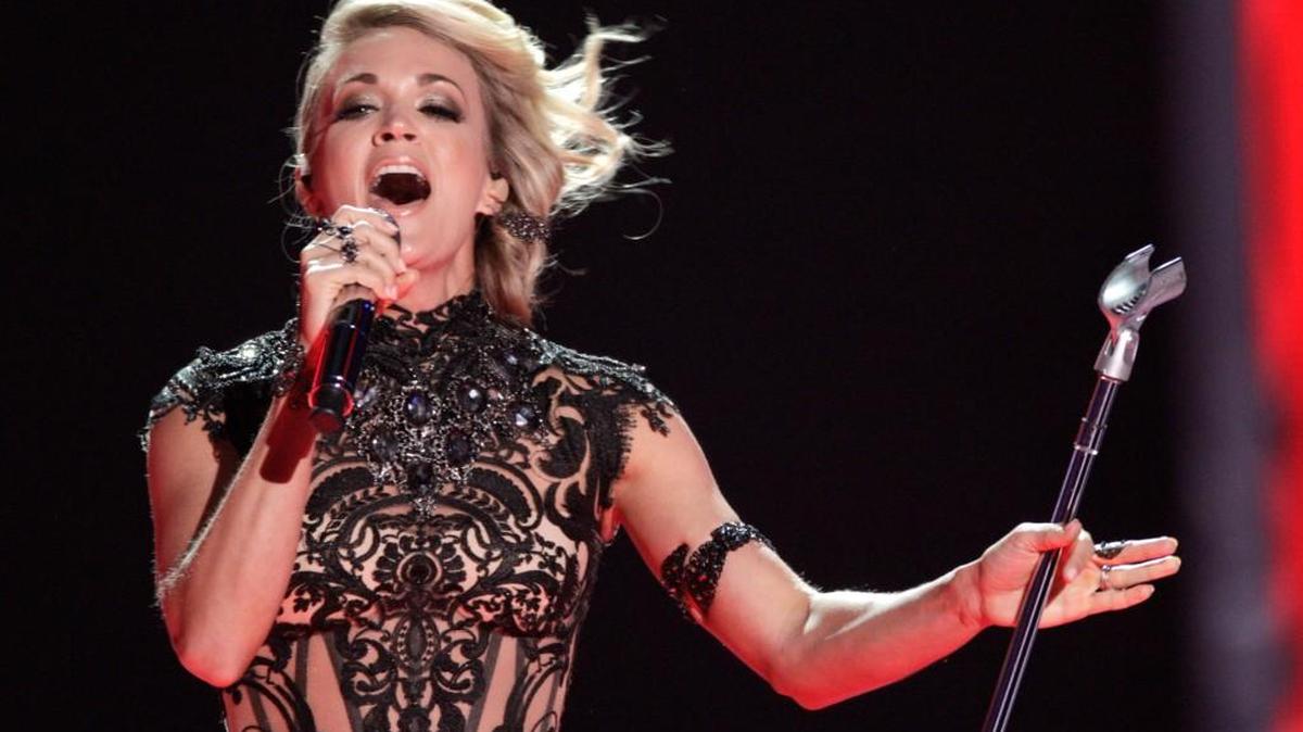 Carrie Underwood will be singing a new theme song, “Oh, Sunday Night,” during the first game telecast on Sept. 11 between the New England Patriots and the Arizona Cardinals. The song is based on her 2014 hit country duet “Somethin’ Bad,” with Miranda Lambert, but with new lyrics and additional changes to fit the program. (Photo by Wade Payne/Invision/AP, File)