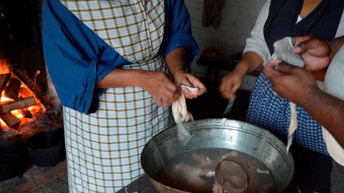 Cleaning chitterlings during the Hog Butchering Day at Historic Brattonsville.
