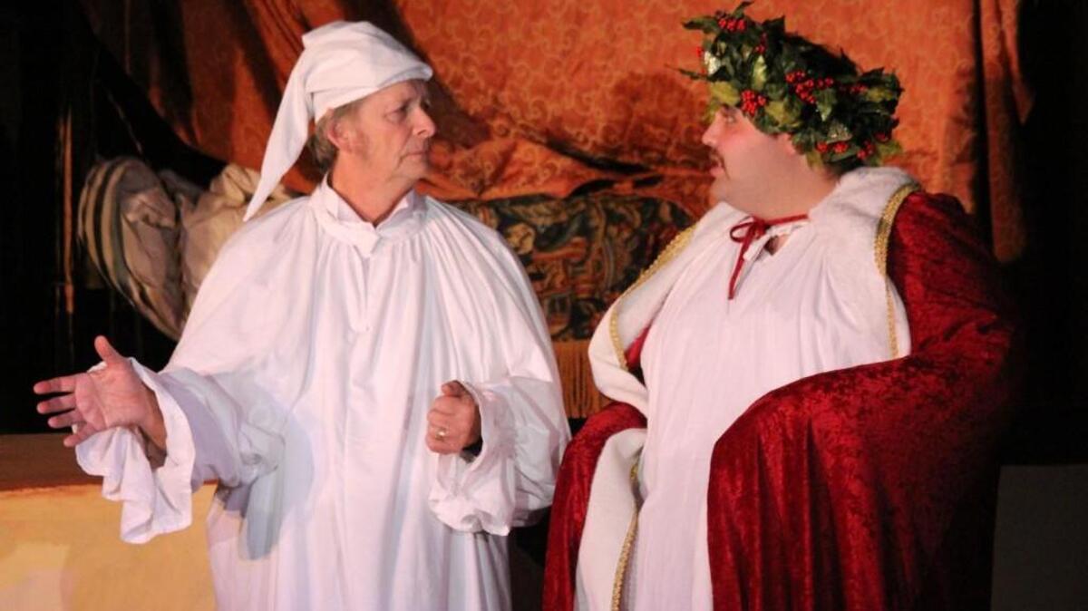 Ebenezer Scrooge (Michael Devokaitis) is visited by The Ghost of Christmas Present (Mike Van Luvender) in “Scrooge’s Christmas.”
