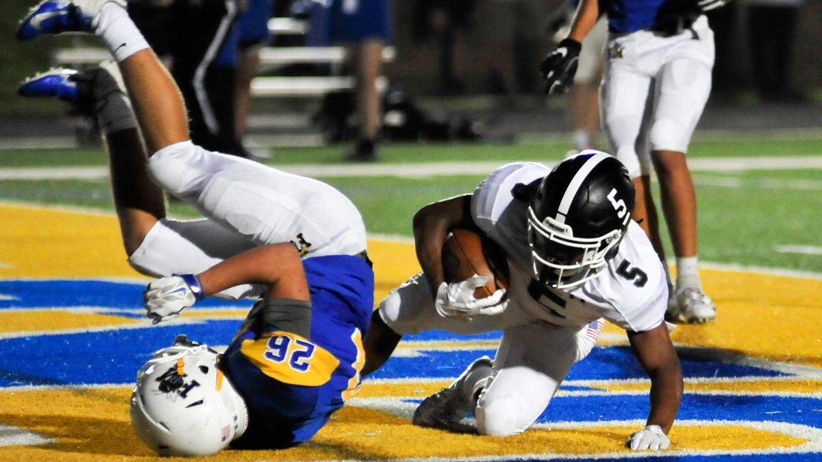 Fort Mill junior Steven Neese, left, is unable to keep York senior Stephen Oglesby out of the endzone. Oglesby scored three touchdowns in the first half at Fort Mill’s homecoming game on Sept. 21. The Cougars led the Yellow Jackets 21 to 7 at the half. York was 0 and 3 for the season before Friday night’s game, while York was 1 and 4.