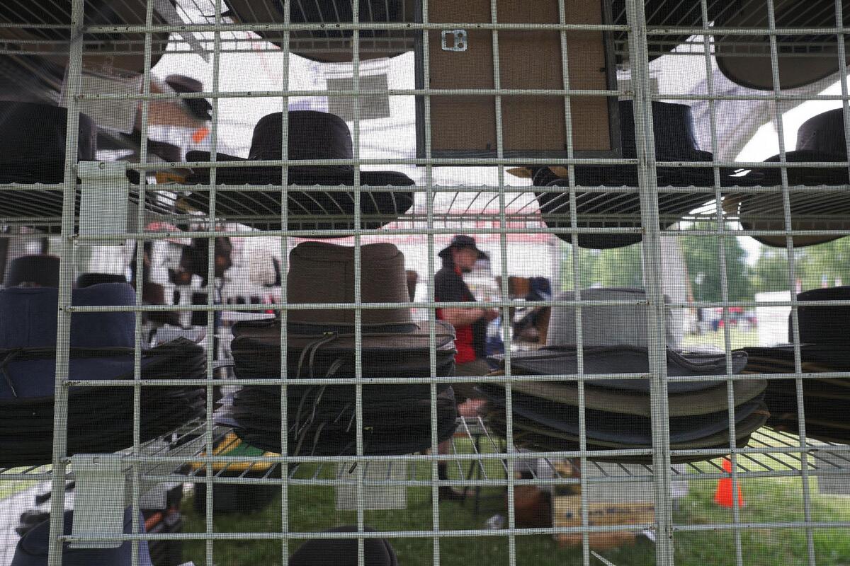 A hat vendor works his booth Friday, May 2, 2025 at the Strawberry Festival in Fort Mill.