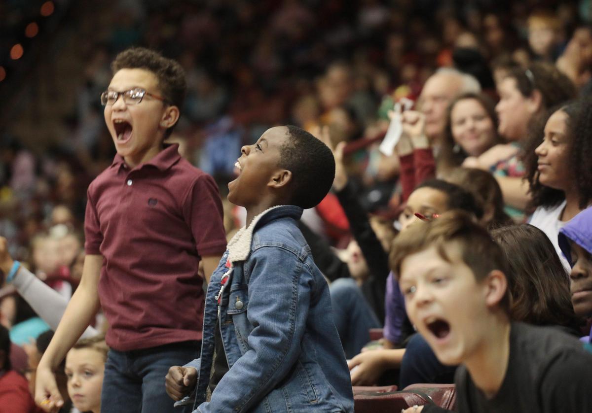 Elementary school children from Rock Hill scream during the Winthrop men’s basketball game Tuesday at the Winthrop Coliseum.