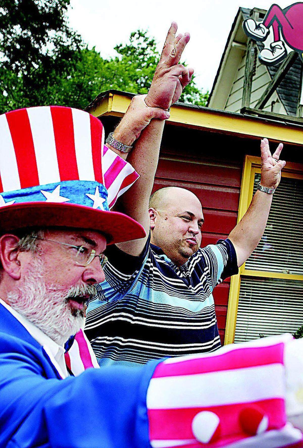 In this 2008 Herald file photo, Ebenezer Grill owner Loyd Ardrey, left, declares Dale Corzine the winner of the eatery's third Annual All-American Fourth of July Hot Dog Eating Contest after he ate 14 1/2 hot dogs. It was the third straight year Corzine won the contest.