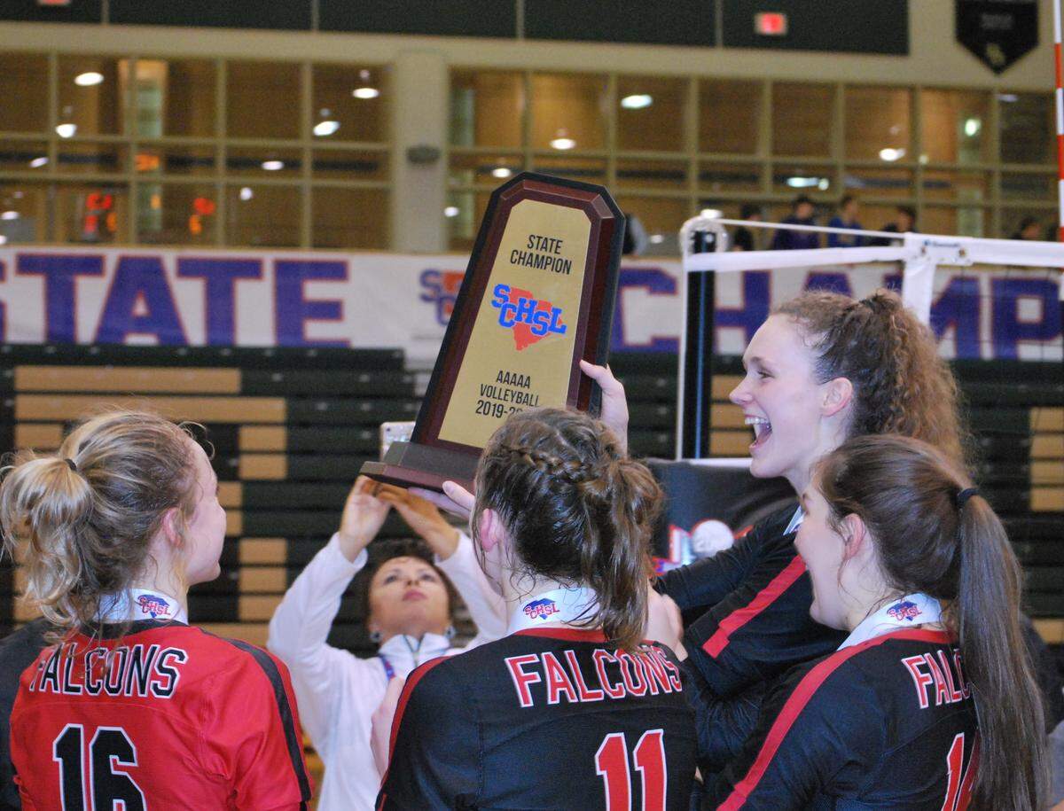 Nation Ford senior Sophie Fischer, far right, and teammates hold the 5A state championship trophy that the Falcons won over Lexington on Saturday evening. The Falcons won their second consecutive state volleyball championship.