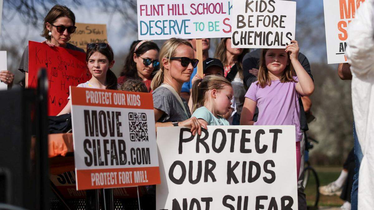 People gather at Walter Elisha Park in Fort Mill, SC to protest Silfab Solar on Friday, March 6, 2026.