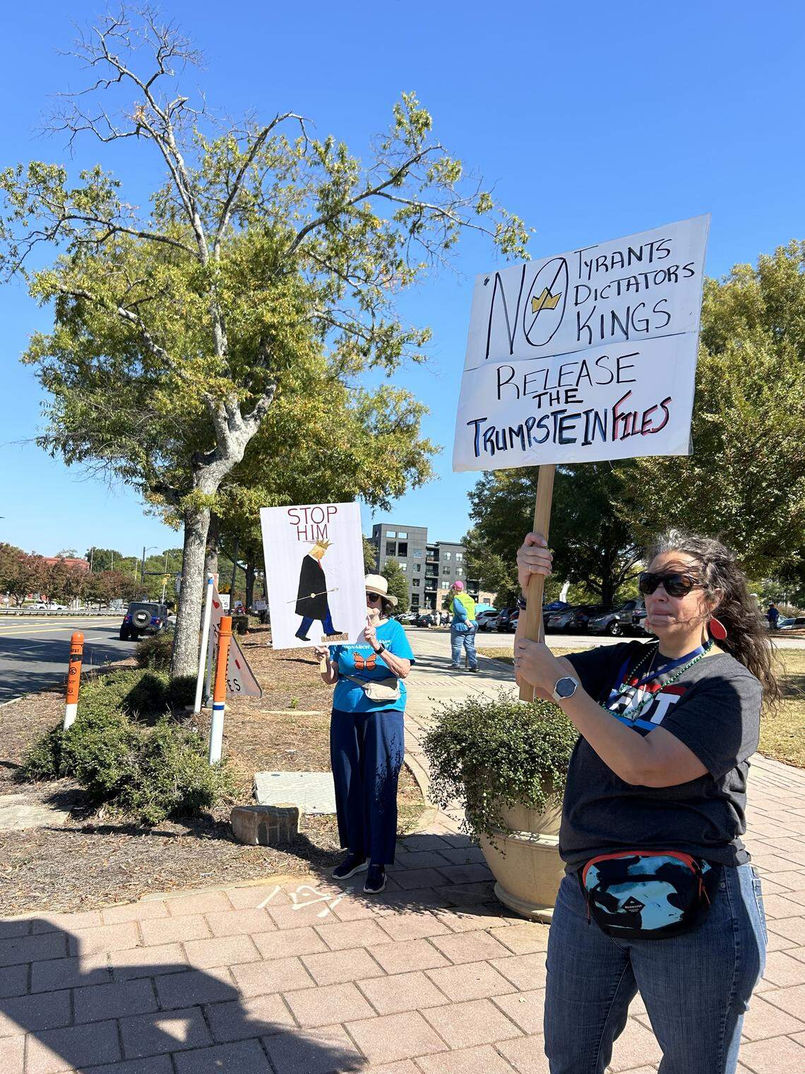 At the corner of Savely Lyle and Main Street in downtown Rock Hill, Melody Kearse held up her sign to show her displeasure with the Trump administration.