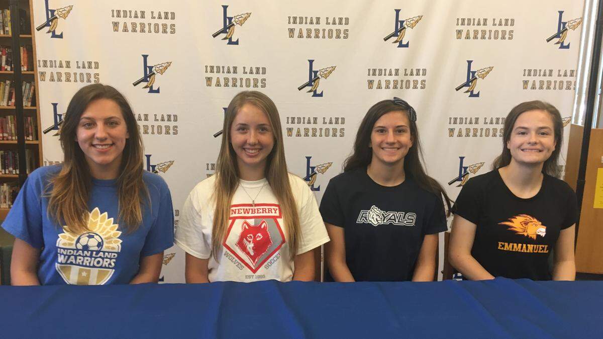 Indian Land High School Warriors Abby Curry, Kailee Erwin, Summer Bishop and Brianna Bishop participate in a college soccer signing at Indian Land High School.