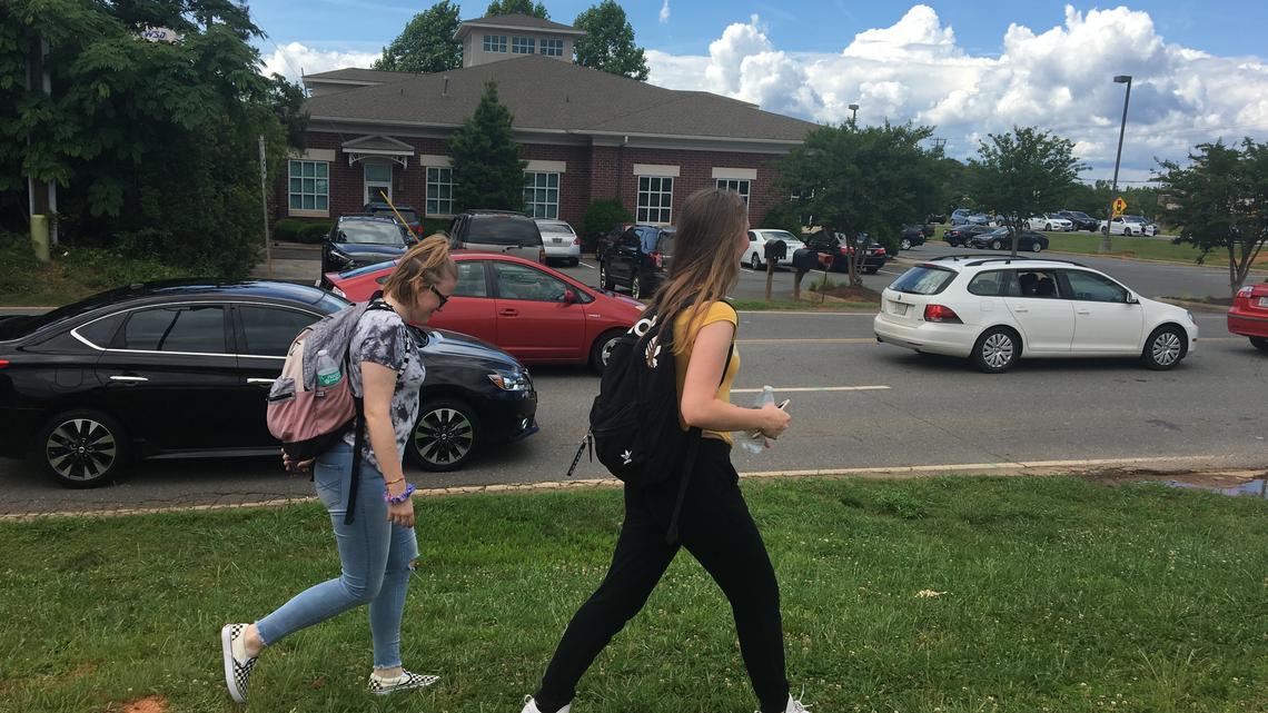 Indian Land High School students navigate around traffic after school last week. If the Rock Hill-Fort Mill Area Transportation Study finalizes funding on June 22, the students will soon have a sidewalk along River Road.