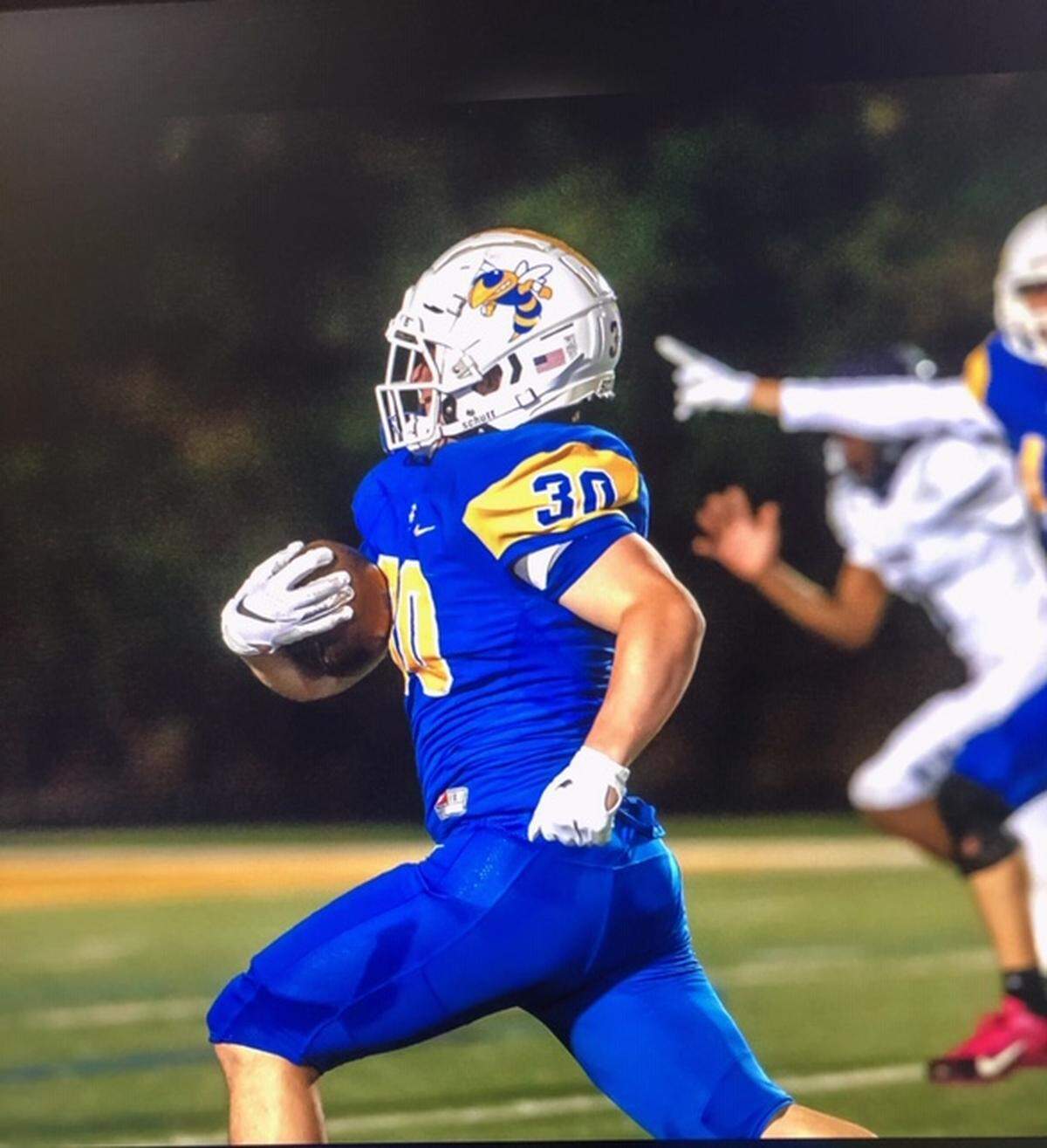 Miller Shouse returns an interception for a touchdown against Clover in October 2020.