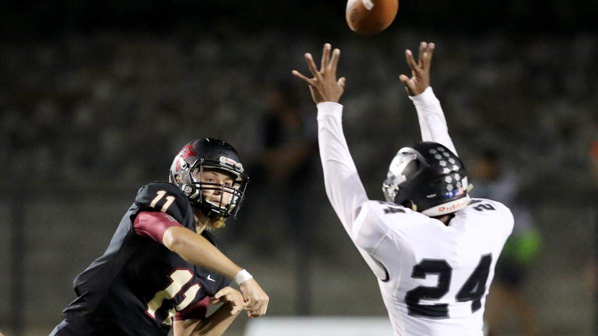 Rock Hill hosted York  September 20, 2019. Rock Hill quarterback Jackson Roberson throws a pass over Yotk’s Aronde Roberts.
ANDY BURRISS-Special to The Herald