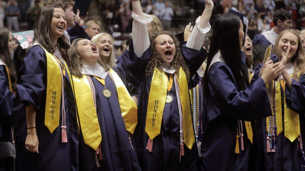 Clover High School graduates cheer after the ceremony at the Winthrop Coliseum on Thursday, May 26, 2022.
