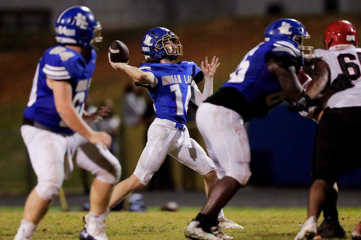 Indian Land quarterback (14) Blake Goode throws deep as Indian Land hosts Nation Ford in Friday night football action. 8-20-2021.