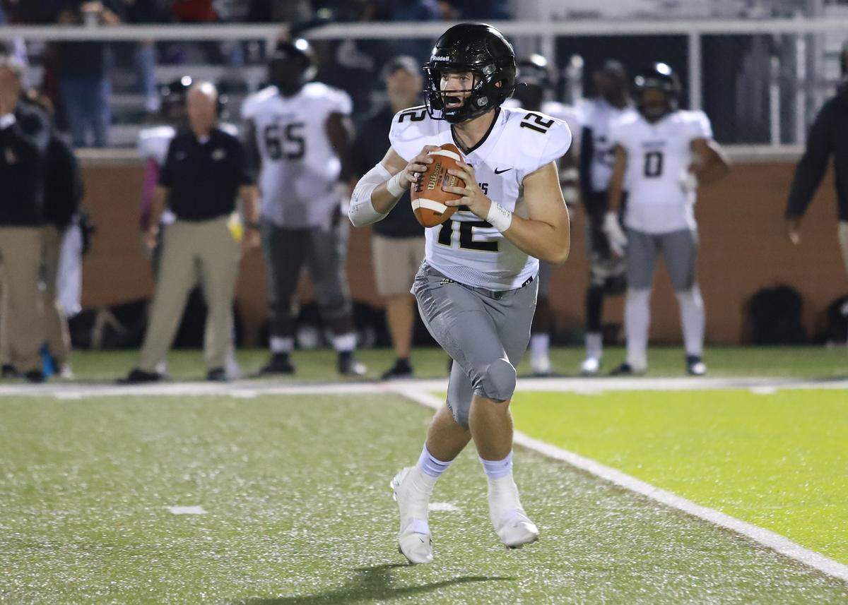 Grayson Loftis, Gaffney quarterback, scrambles in his team’s win over Clover on the road on Friday night.