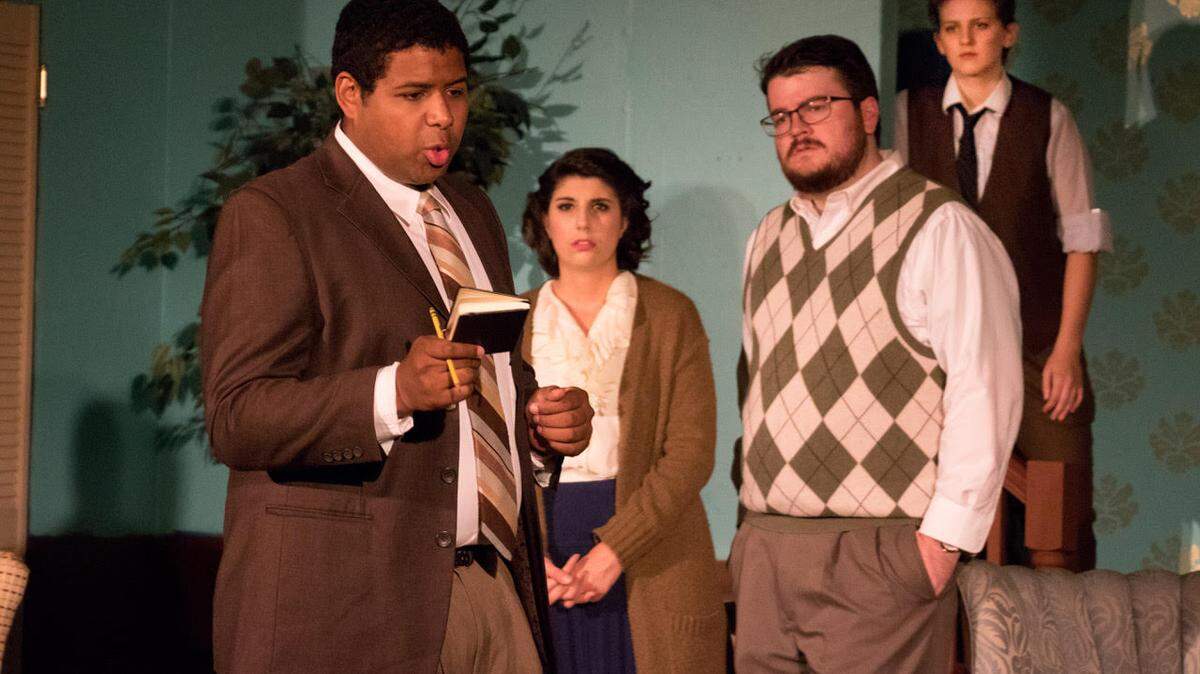Detective Sergeant Trotter (played by Logan Stamey), works through the facts of the case in Agatha Christie’s murder mystery, ‘The Mousetrap,’ opening Thursday at The Rock Hill Community Theatre. Also pictured, left to right are Stefani Cronley as Mollie Ralston, Charles Hardy as Giles Ralston, Katherine Woltal as Miss Casewell.