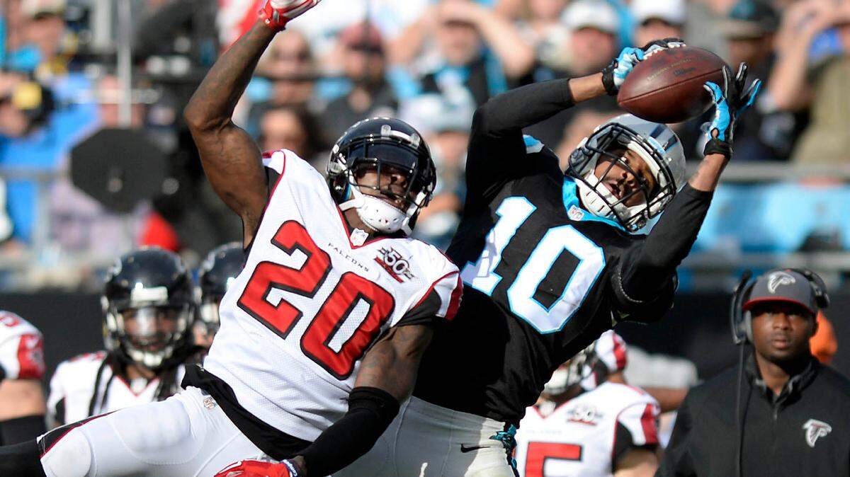 Carolina Panthers’ Corey Brown (10) makes a reception past Atlanta Falcons’ Phillip Adams (20) late in the second quarter at Bank of America Stadium on Sunday, December 13, 2015.