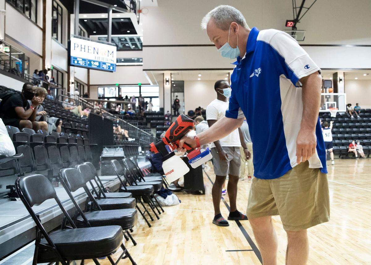 One of the many COVID-19 precautions Phenon Hoops took this past weekend (July 31-Aug. 2) in the Rock Hill Sports and Event Center is sanitizing the basketballs and benches in between games.