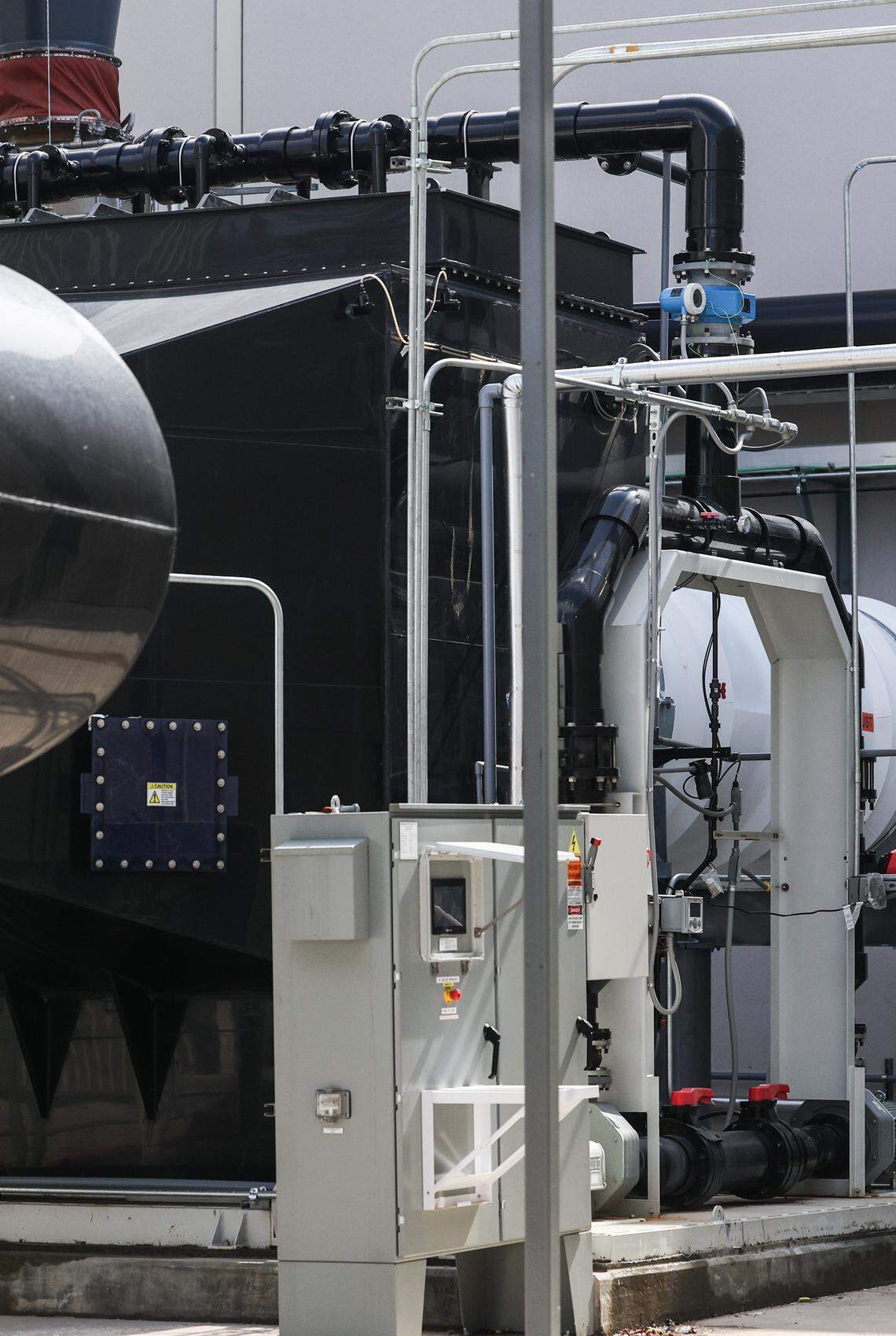 On Tuesday, a wet essex scrubber, the black structure, accidentally released 300 gallons of water containing small amount of potassium hydroxide at Silfab Solar in Fort Mill. 