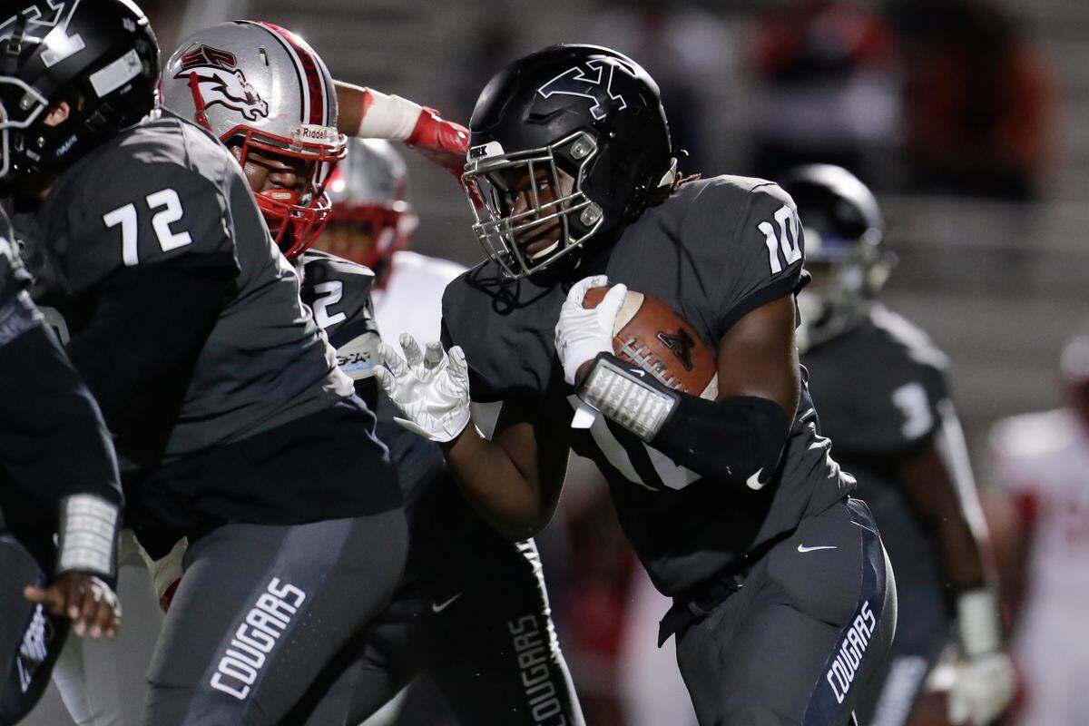 York’s #10 RJ Glasgow carries the ball in first half play as the York Cougars host the South Point Stallions in conference play Friday night, 10-23-2020.