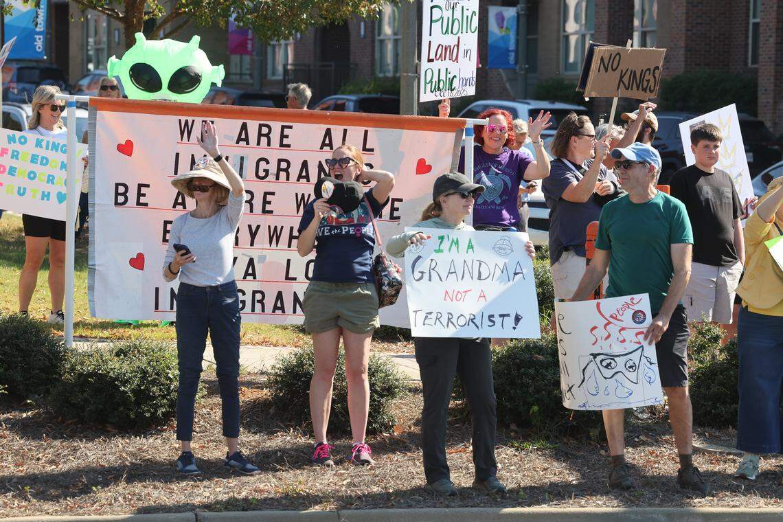 Protesters yell at honking cars Saturday at the Rock Hill ‘No Kings’ rally.