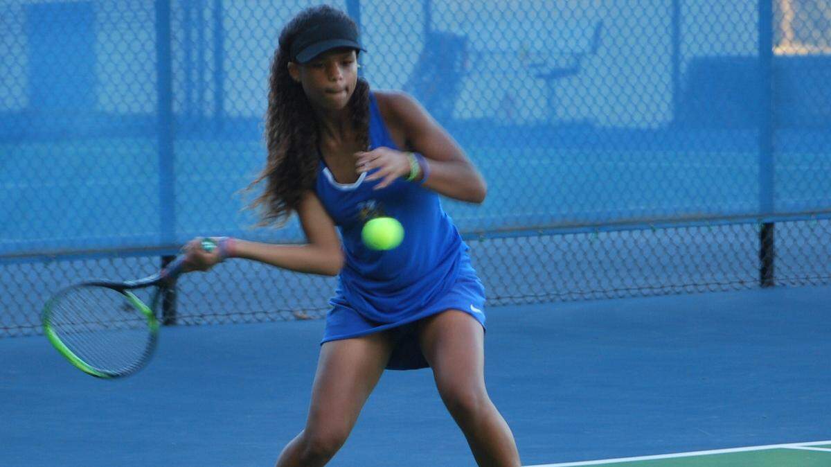 Fort Mill’s No. 2 singles player Kaedyn Willis returns a shot during her match against Wade Hampton in the second round of the 5A state playoffs.