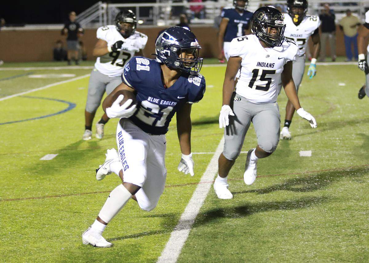 DeMarco Evans runs to the outside in Clover’s 21-3 region loss to Gaffney on Friday night in Memorial Stadium.