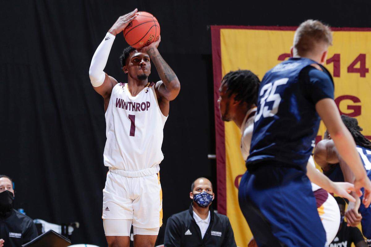 Winthrop’s #1 Toneari Lane puts up a 3 point shot in first half play as Winthrop takes on Longwood in Big South conference men’s basketball at Winthrop Coliseum on Thursday, January 14, 2021 in Rock Hill, South Carolina.