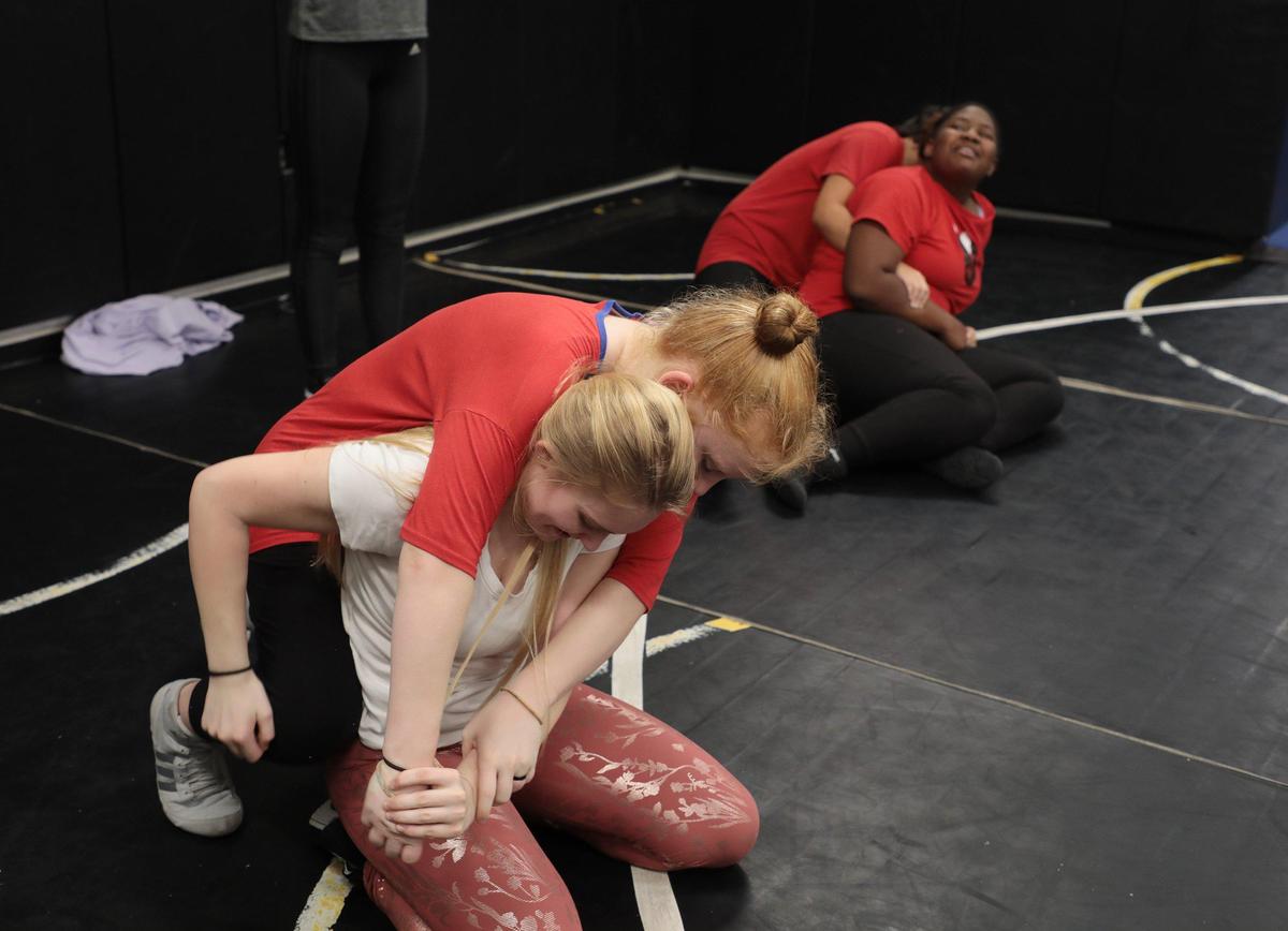 Members of the Rock Hill High School girls wrestling team practice after school last week.
