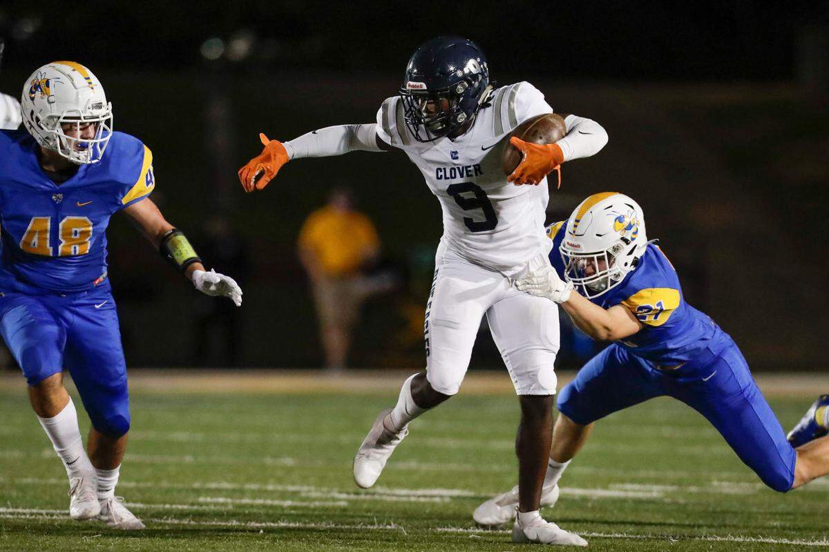 Herald file (2020): Clover’s #9 Chance Mackey trys to break free as Fort Mill hosts Clover in Friday night Varsity football, 10-2-2020.