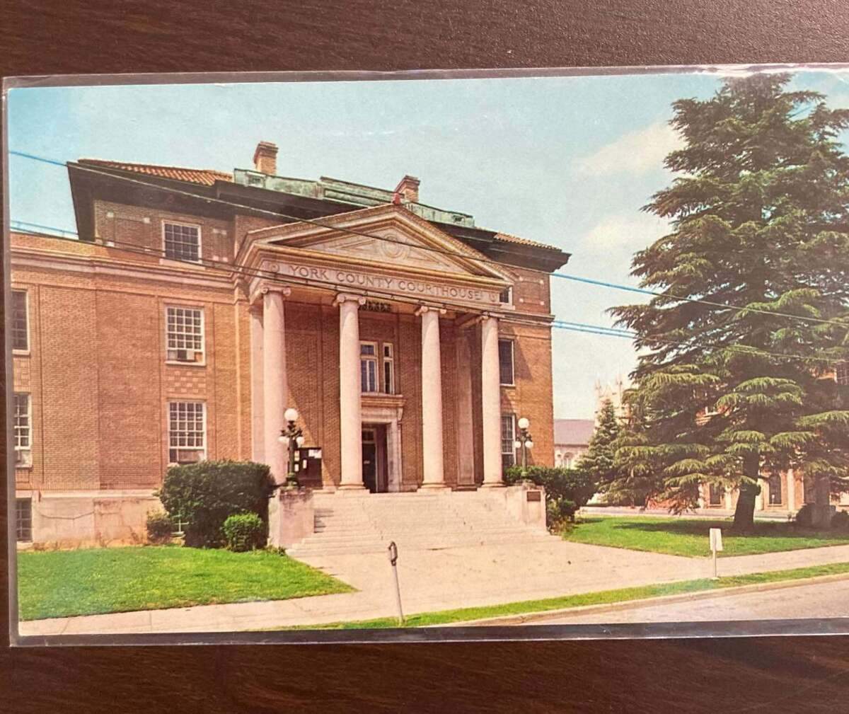 Lowell Joerg has been mailing postcards to the places they depict for 50 years. He sent this postcard of the York County Courthouse to clerk of court in June.