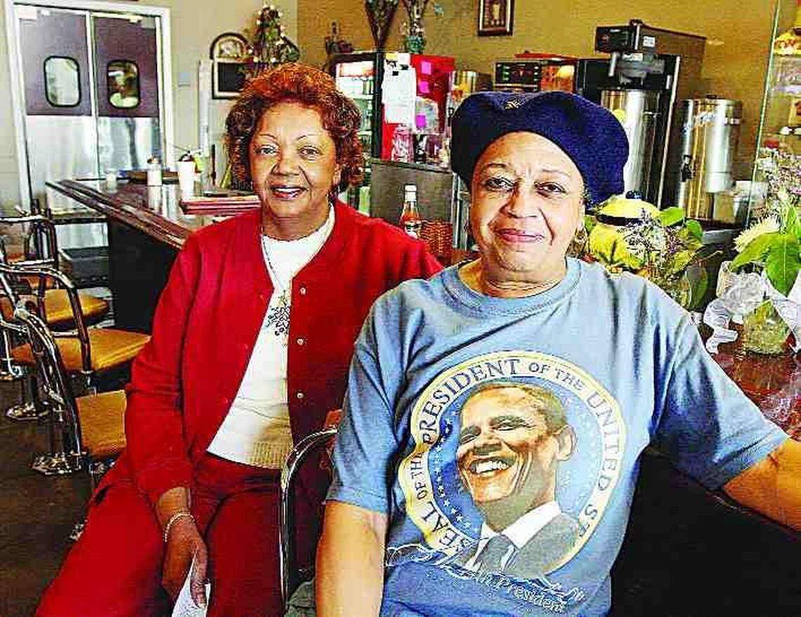 Phyllis Thompson Hyatt, left, and Elsie White Springs, "City Girls" then and now, sit beside the lunch counter at the Old Town Bistro in Rock Hill on Tuesday. This was the site of lunch counter protests in 1961.