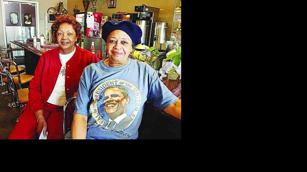 Phyllis Thompson Hyatt, left, and Elsie White Springs, "City Girls" then and now, sit beside the lunch counter at the Old Town Bistro in Rock Hill on Tuesday. This was the site of lunch counter protests in 1961.