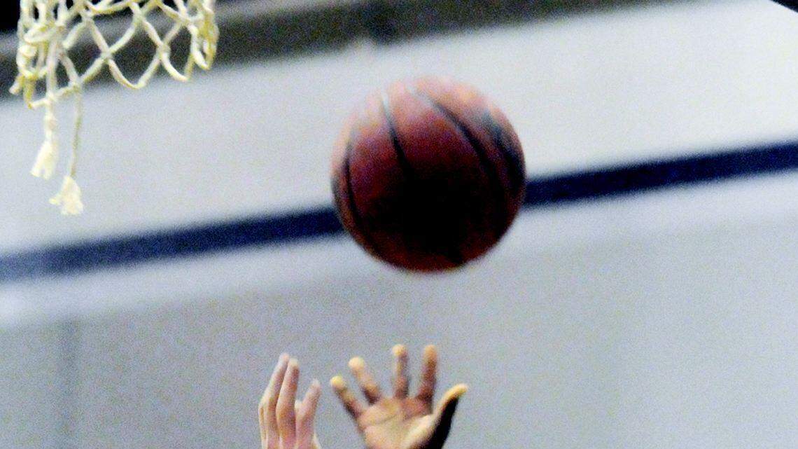 Clover's Alexander Wiley, right, goes for a layup with Northwestern's Shaun Ferguson defending on Tuesday.