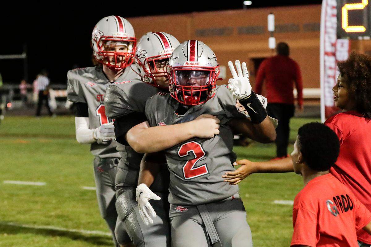 South Pointe’s (2) Caleb Sims celebrates the winning touchdown in the third overtime period as the South Pointe Stallions host the South Florence Bruins in Friday night football action, 9-17-2021.