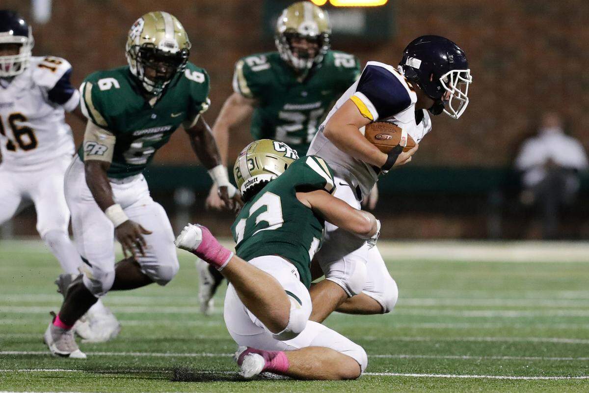 Catawba Ridge’s #23 Brody Tesimale sacks Lancaster QB #10 Ron Robinson at the end of first half play as Catawba Ridge hosts Lancaster in Friday night varsity football. 10-9-2020. Tesimale missed most of 2021 with an injury.