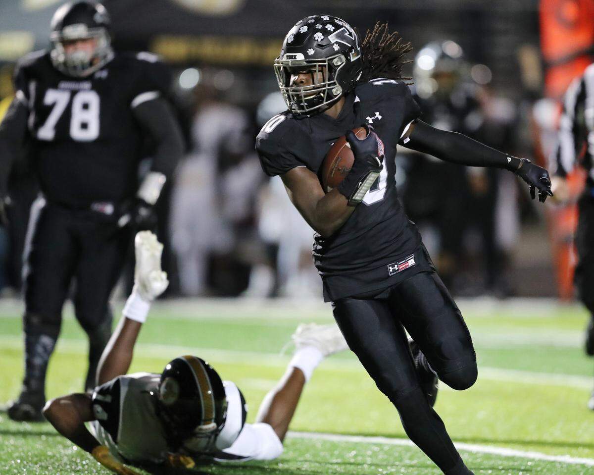 York Comprehensive High School hosted Irmo in the first round of the state playoffs November 5, 2021. York’s Zadarrius Carter escapes from Irmo’s Taevion Brown. Andy Burriss-Special to The Herald