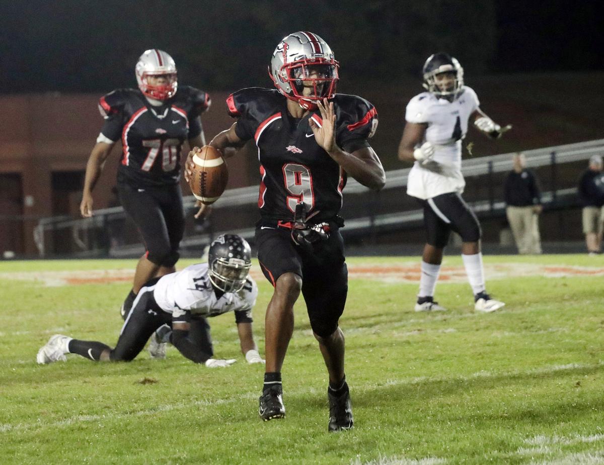 South Pointe’s O’mega Blake carries the ball Friday. The South Pointe Stallions competed agains the York Cougars in varsity football.