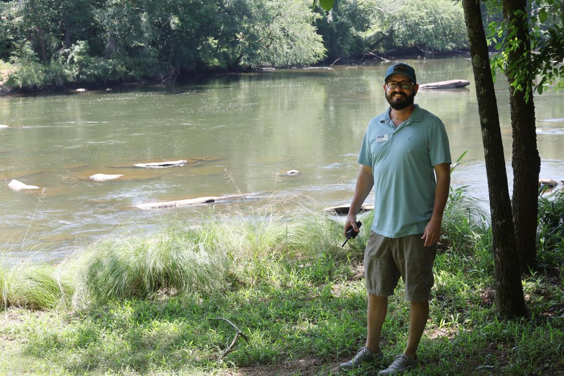 Matt Harper, executive director at Camp Canaan in Rock Hill, S.C. stands near the Catawba River. The camp is located on an island on the river.