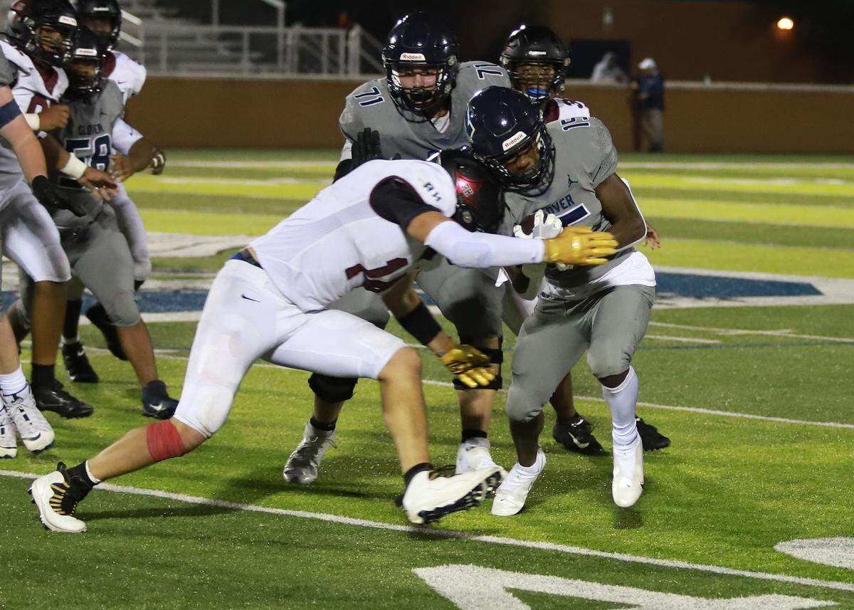Rock Hill’s Luke Bracey attacks for a tackle against a Blue Eagle ball carrier on Friday night (Sept. 25, 2021) in Memorial Stadium in Clover.