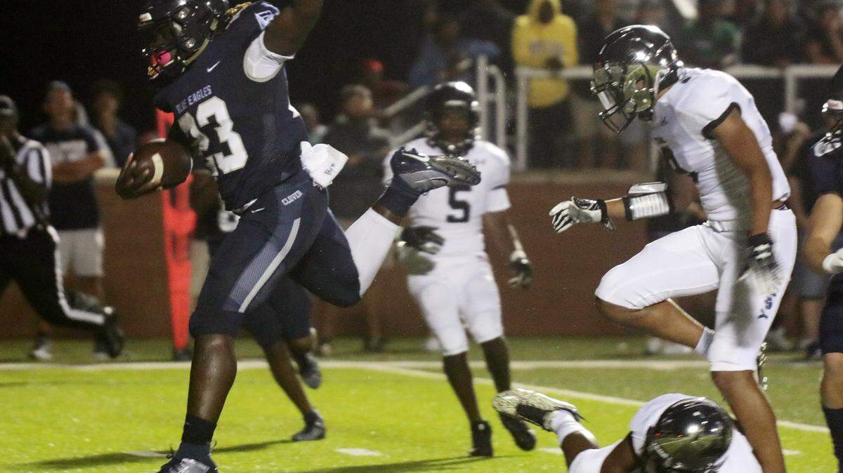 Clover’s David Hall carries the ball.