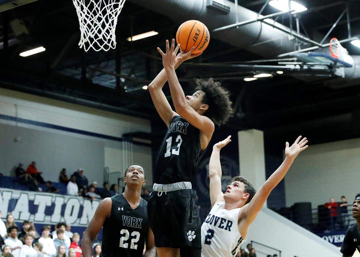 York’s #13 Darrion Dotson puts in 2 points as the Cougars attempt to mount a come back in the second half as the Blue Eagles host York in Friday night basketball action, 12-13-2019.