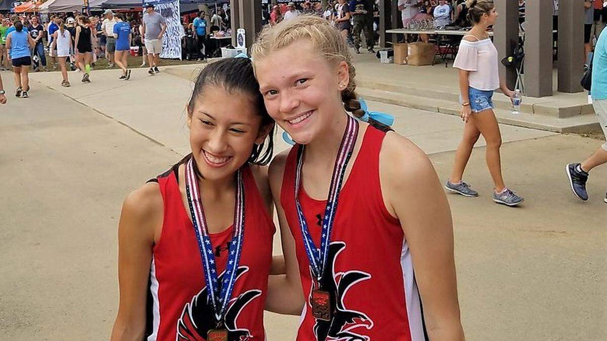 Nation Ford’s Katie Pou (left) finished second out of 228 runners at the Wendy’s Invitiational last weekend in Charlotte, while her teammate, Morgan Werner (right), finished 22nd.