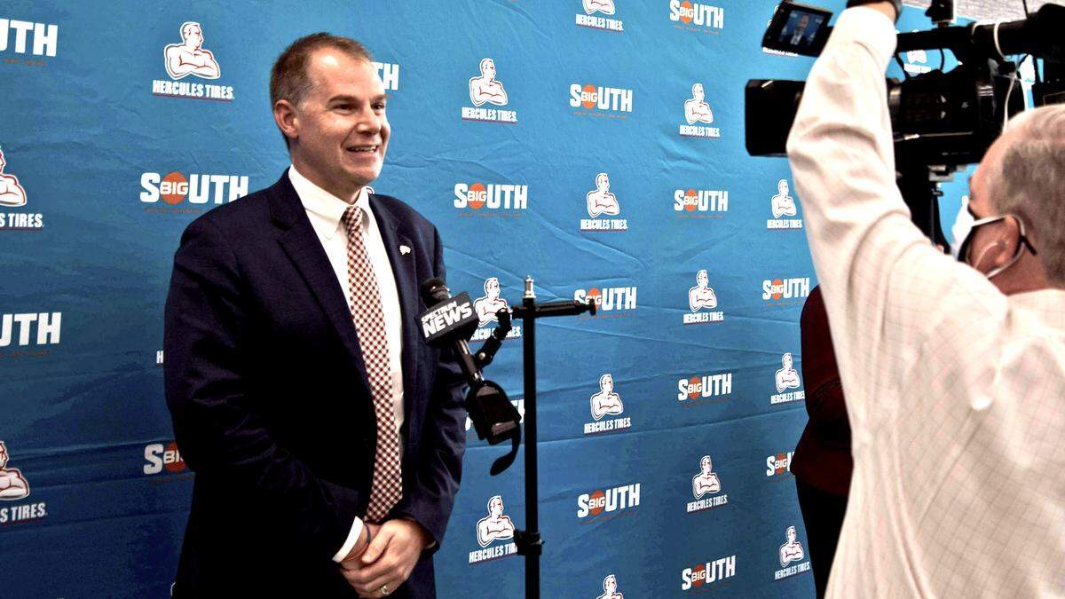 Mark Prosser prepares for a TV interview during the 2021 Big South Conference’s media day on Wednesday.