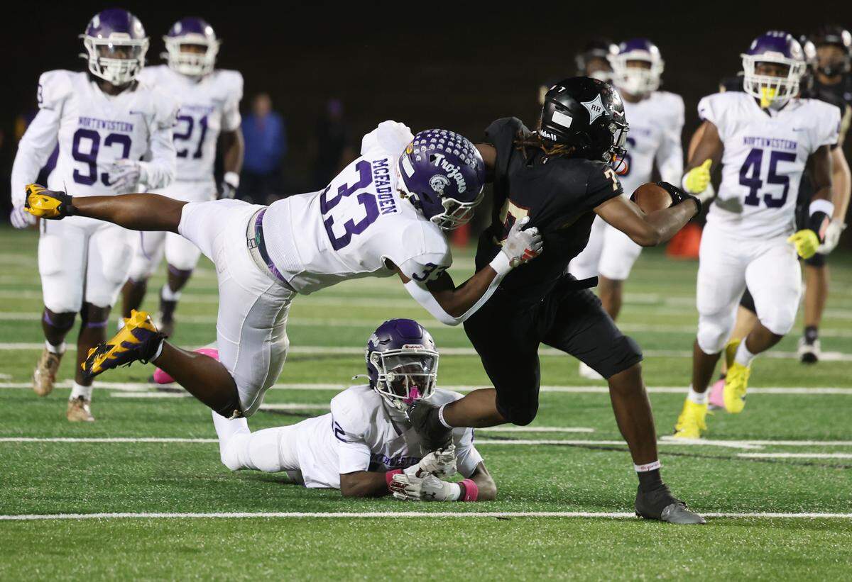 Northwestern's Kamerin McFadden attempts to tackle Rock Hill's Nigel Lightner Friday, Oct. 17, 2025 in Rock Hill, S.C.