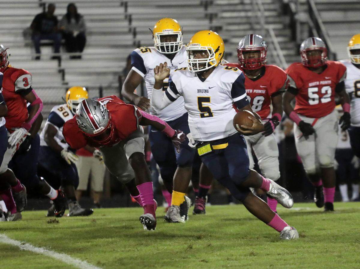 Lancaster’s Sean Truesdale carries the ball during the first half of the game with the South Pointe Stallions Friday in Rock Hill.