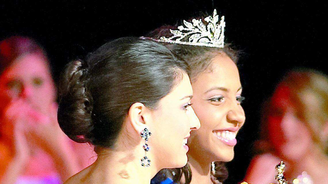 Miss Fort Mill High 2009 Ceci Kryst (middle) is congratulated by first runner-up Lauren Deas (left) and Miss Senior Taylor Hoverman.