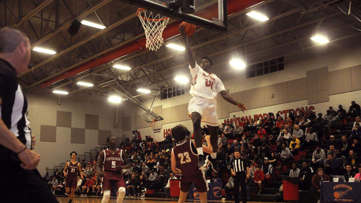 Nation Ford’s Malik Bryant glides in for a layup during the Falcons’ blowout of Porter Gaud Saturday night, Dec. 1, 2018, during the Battle At The Rock basketball tournament.