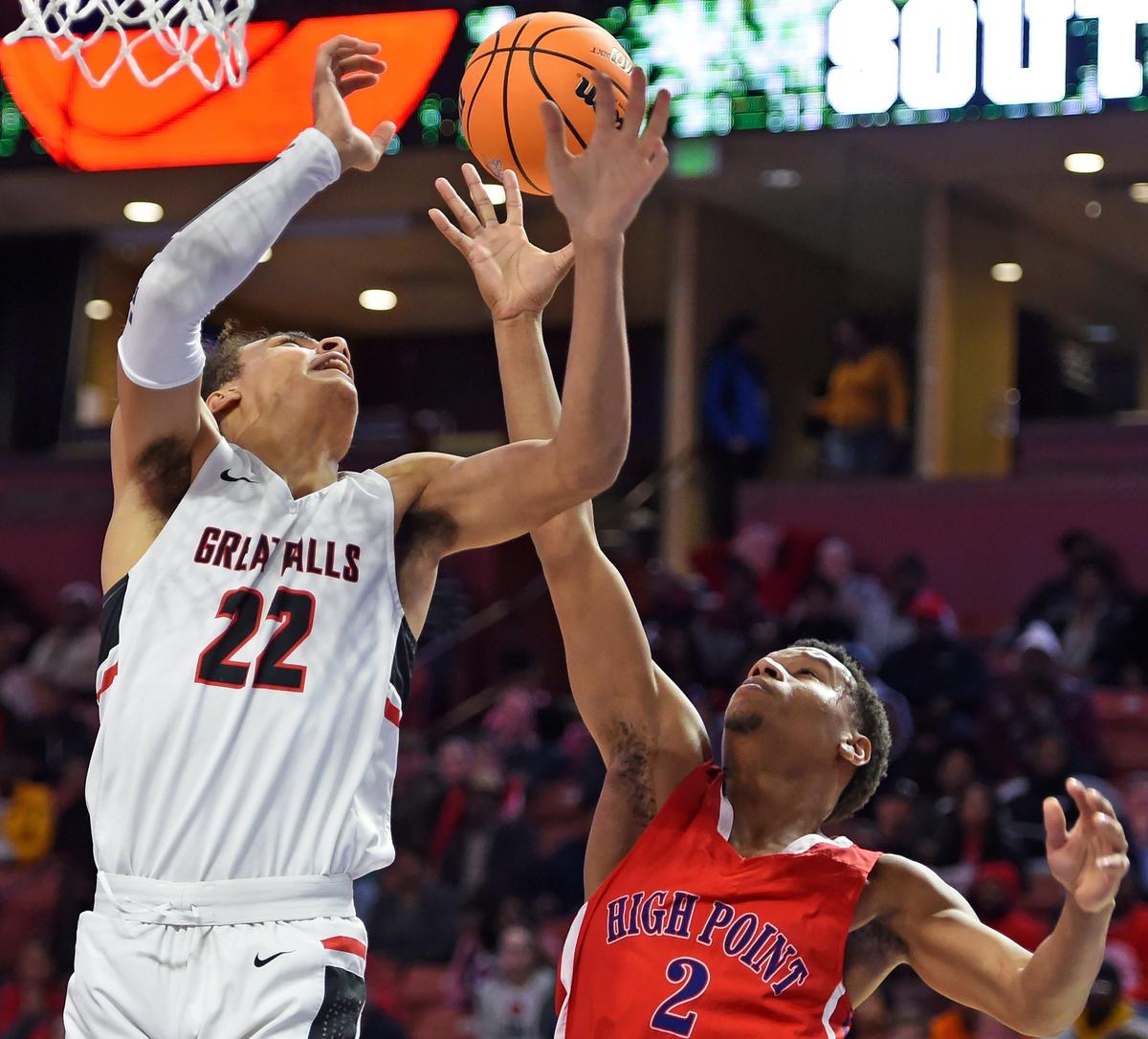 Great Falls’ Kelton Talford (22) goes up for two as High Point’s Jayden Byrd (2) defends. Great Falls played High Point for the Upper State Championship at Bon Secours Wellness Arena in Greenville Friday, February 28, 2020.